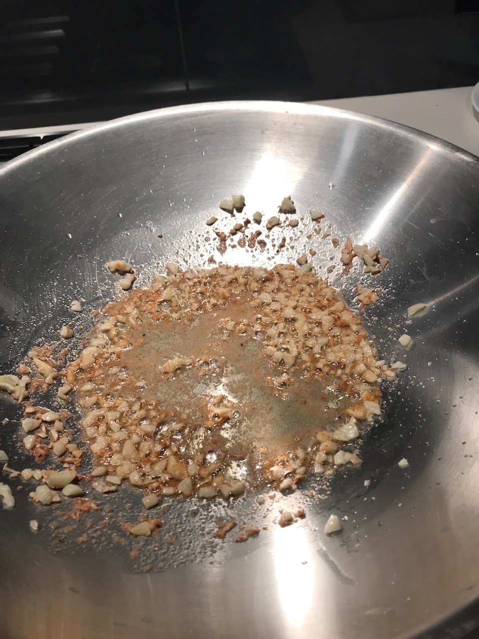 Hot frying pan with garlic and chicken powder